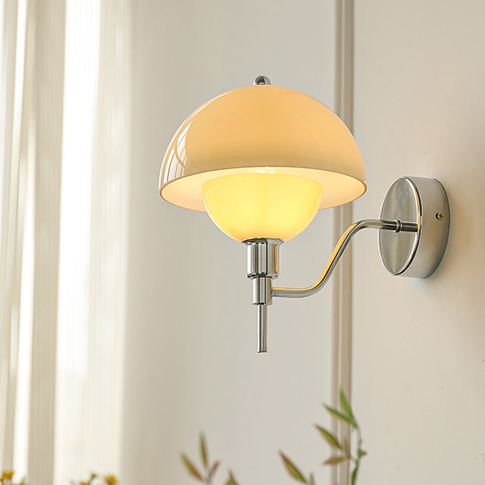 Illuminated Chrome and Beige mushroom glass wall lamp beside a curtain