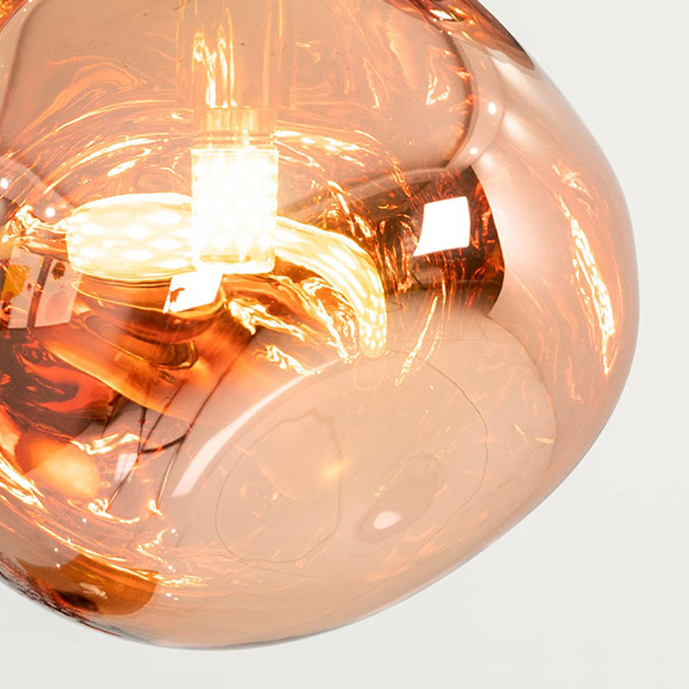 Close-up of a glowing Rose Gold irregular shade showing its translucent surface and coiled light-source shape