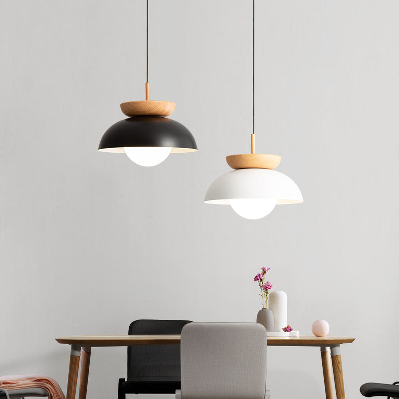 Black and White bowl pendants in a dining-room arrangement