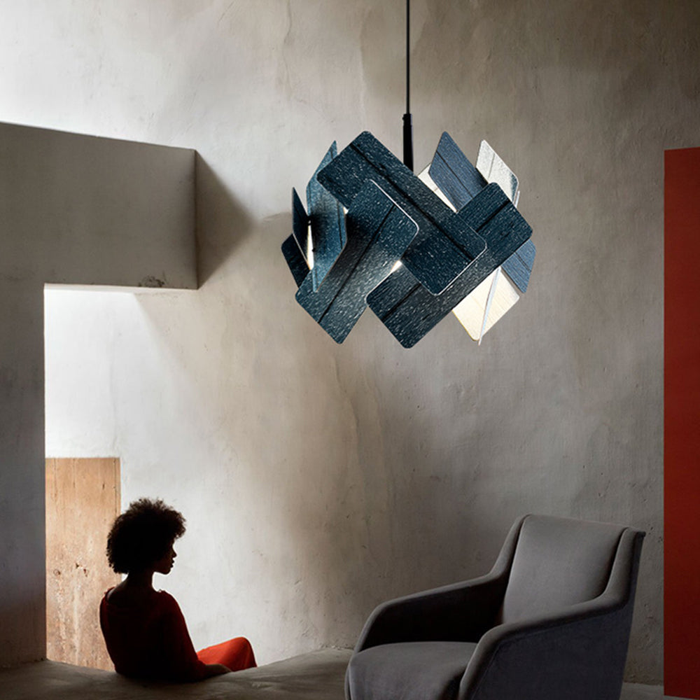 Escape blue geometric pendant above a living-room chair