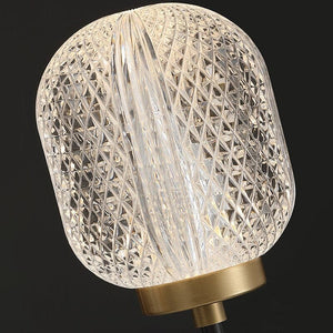 Close-up of the clear shade’s diamond crosshatching and vertical fluting above a gold-tone cup