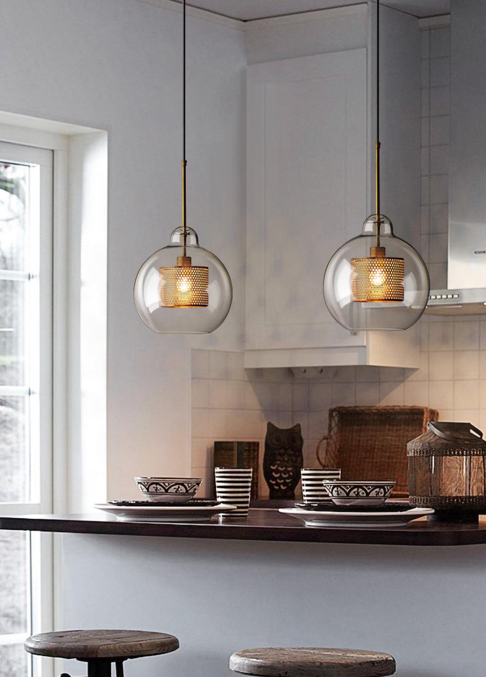 Two rounded pendants over a kitchen counter