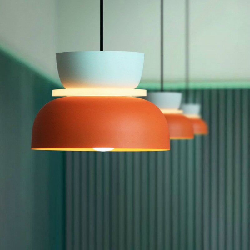 Blue Orange option with a pale-blue upper bowl, glowing central disc and orange shade, with matching pendants behind