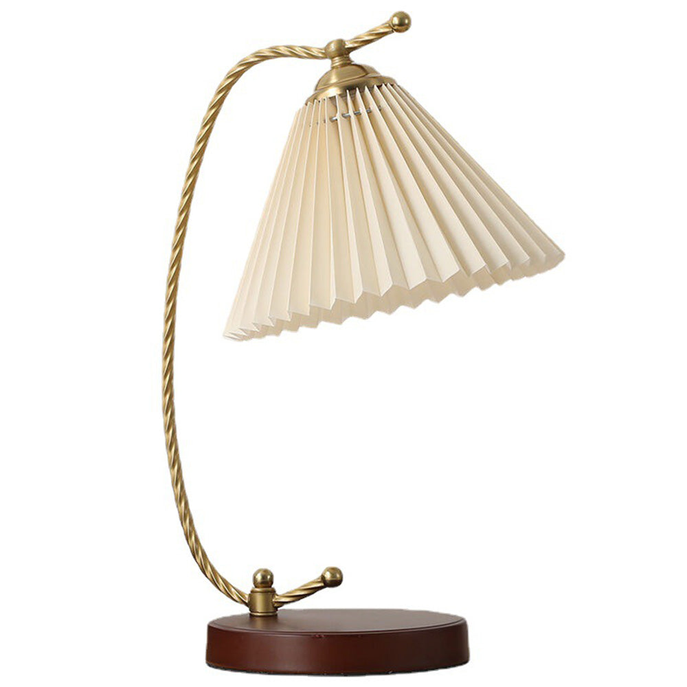 Isolated Dotty lamp with a beige pleated shade, curved twisted stem and round brown-red base