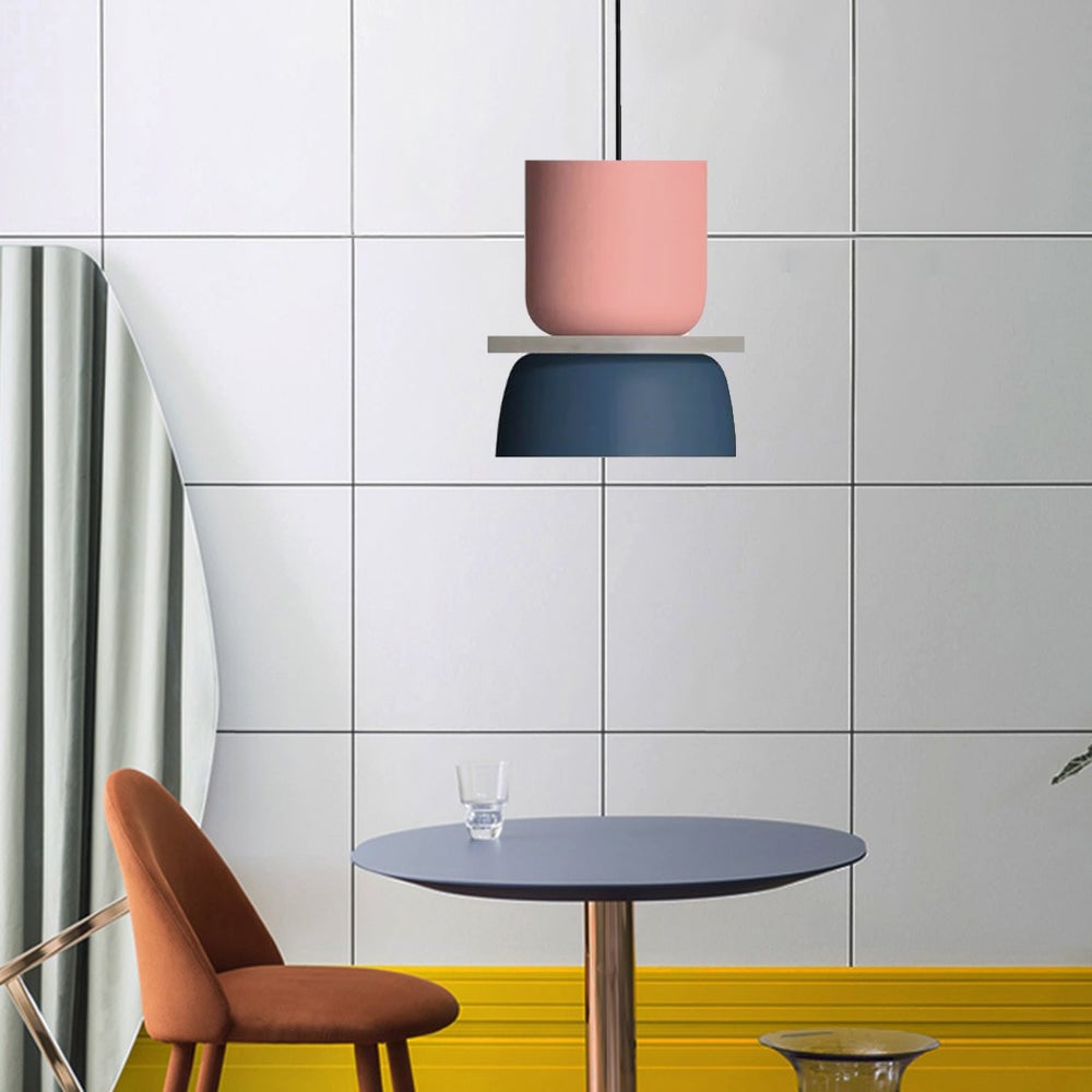 Pink Blue option with a tall pink upper cup and blue lower shade above a round table and orange chair