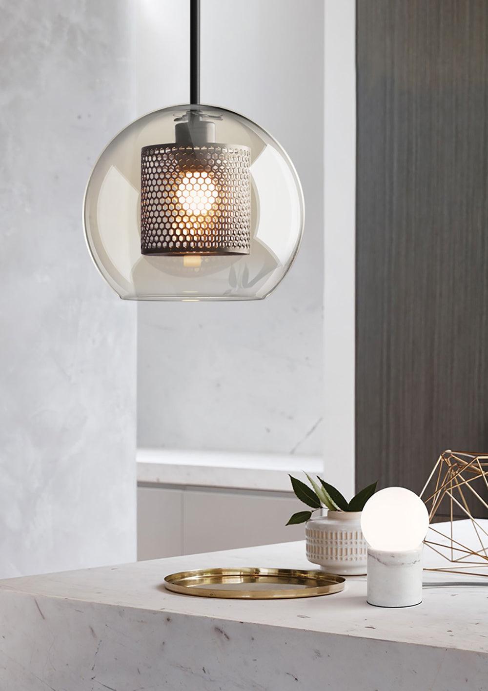 Single rounded glass shade over a small table