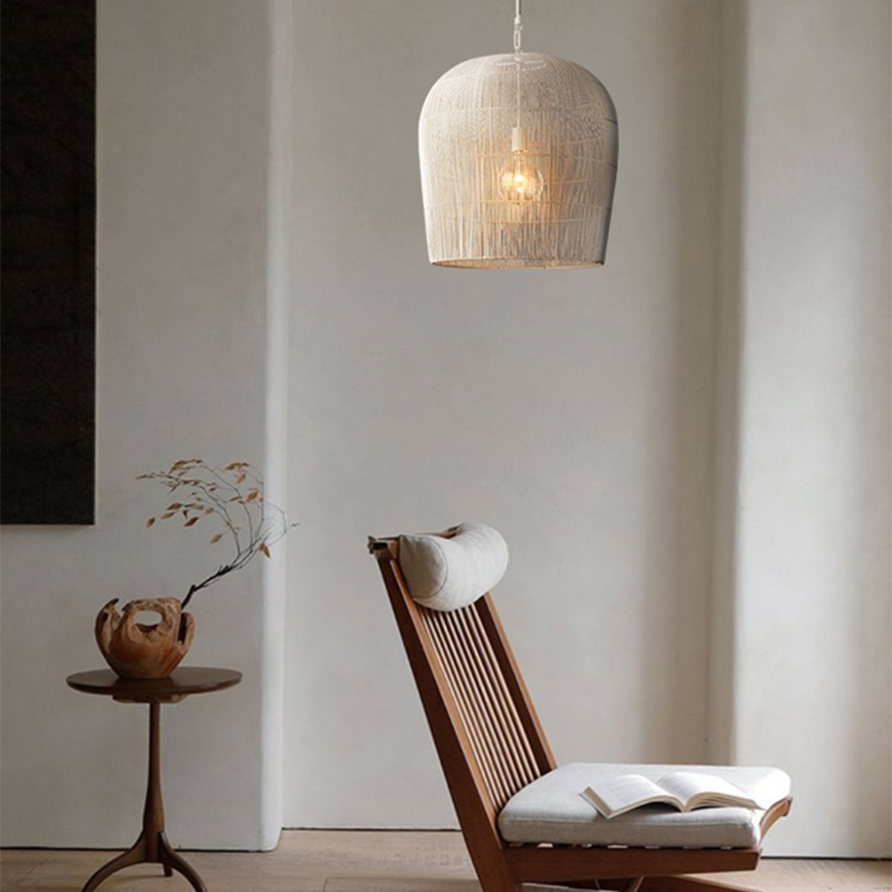 White woven pendant near a wooden lounge chair