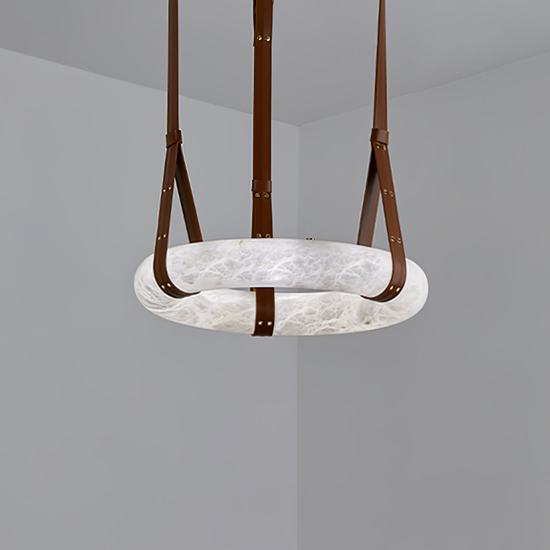 Front perspective of an unlit horizontal ring with brown strap loops.