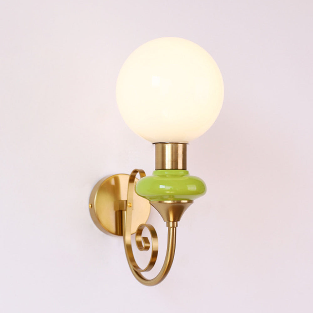 Opposite side view of the gold-and-green wall sconce