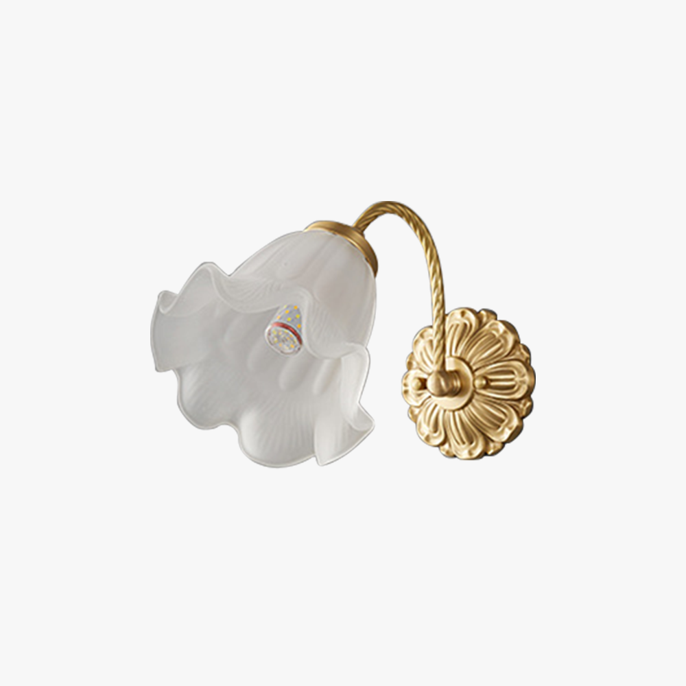 Isolated unlit white petal shade on short arched gold-tone arm and ornate floral wallplate