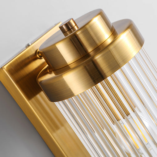 Oblique close-up of Gold stepped upper caps, clear glass rods and the rectangular backplate