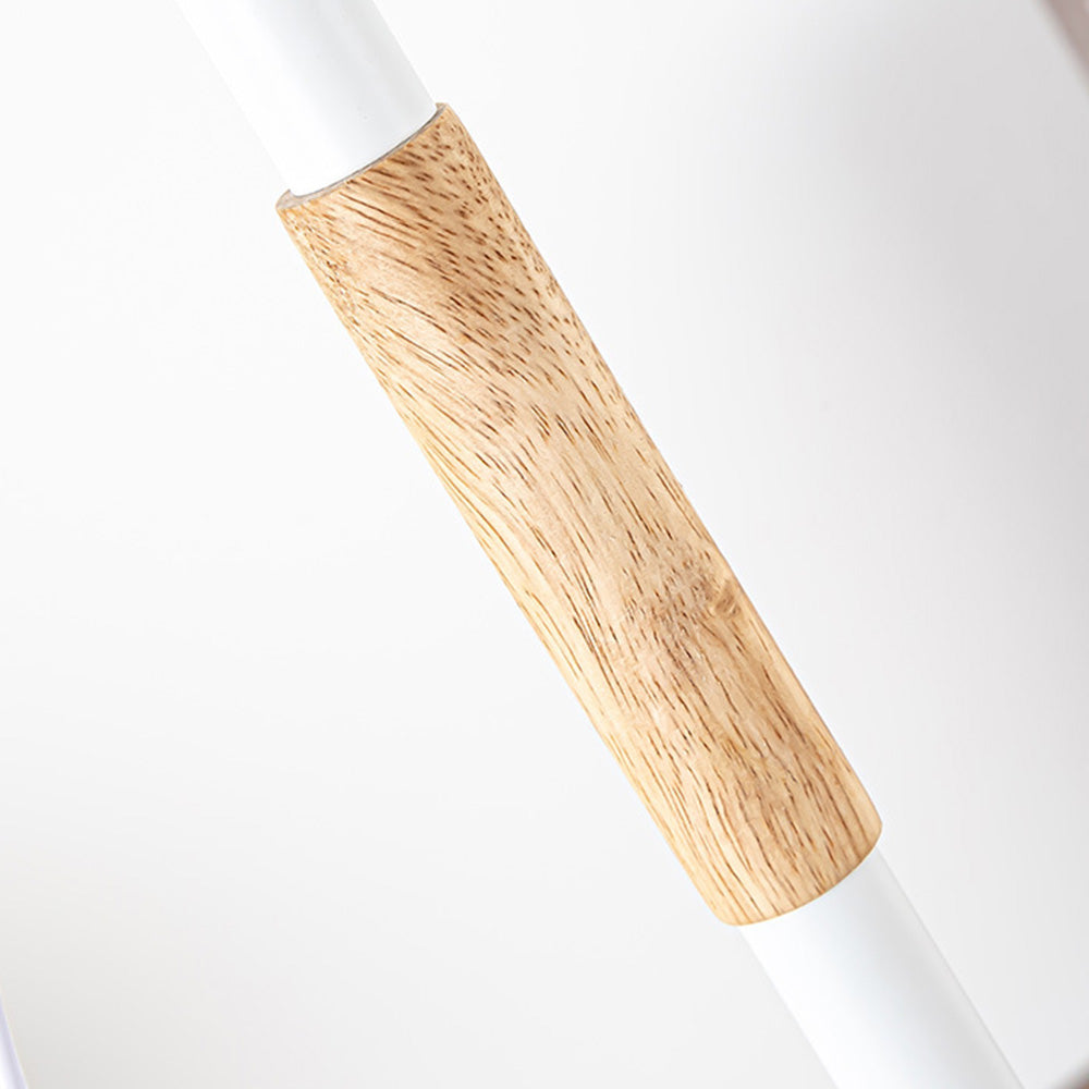 Closeup of wood-grain-looking sleeve around White table lamp stem
