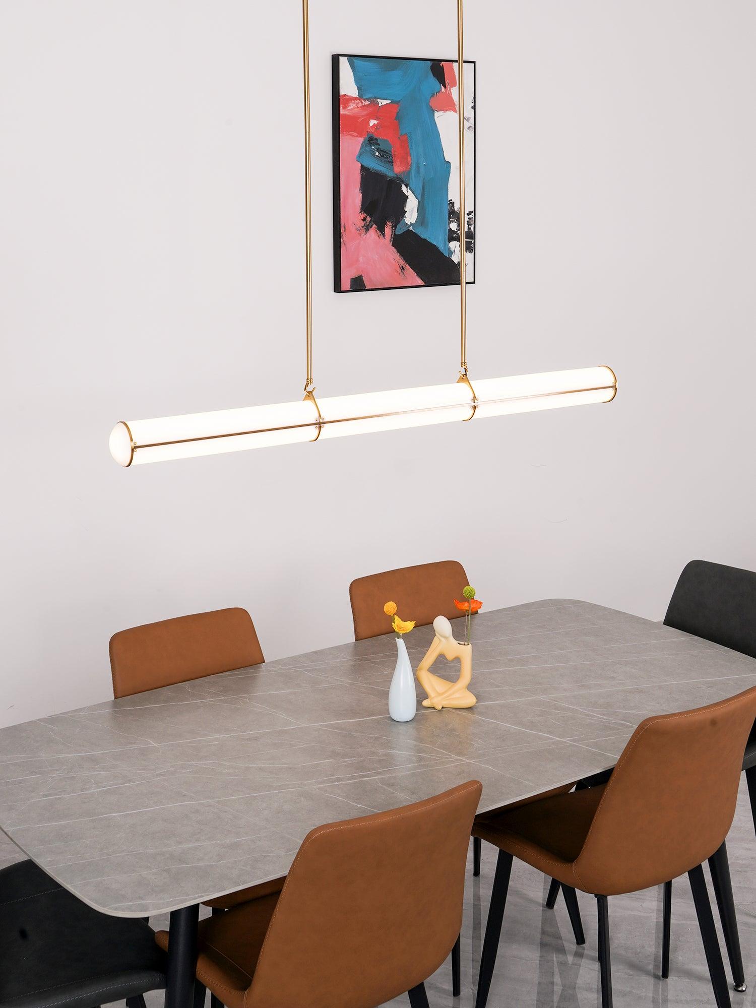 Single cylinder light above a long table