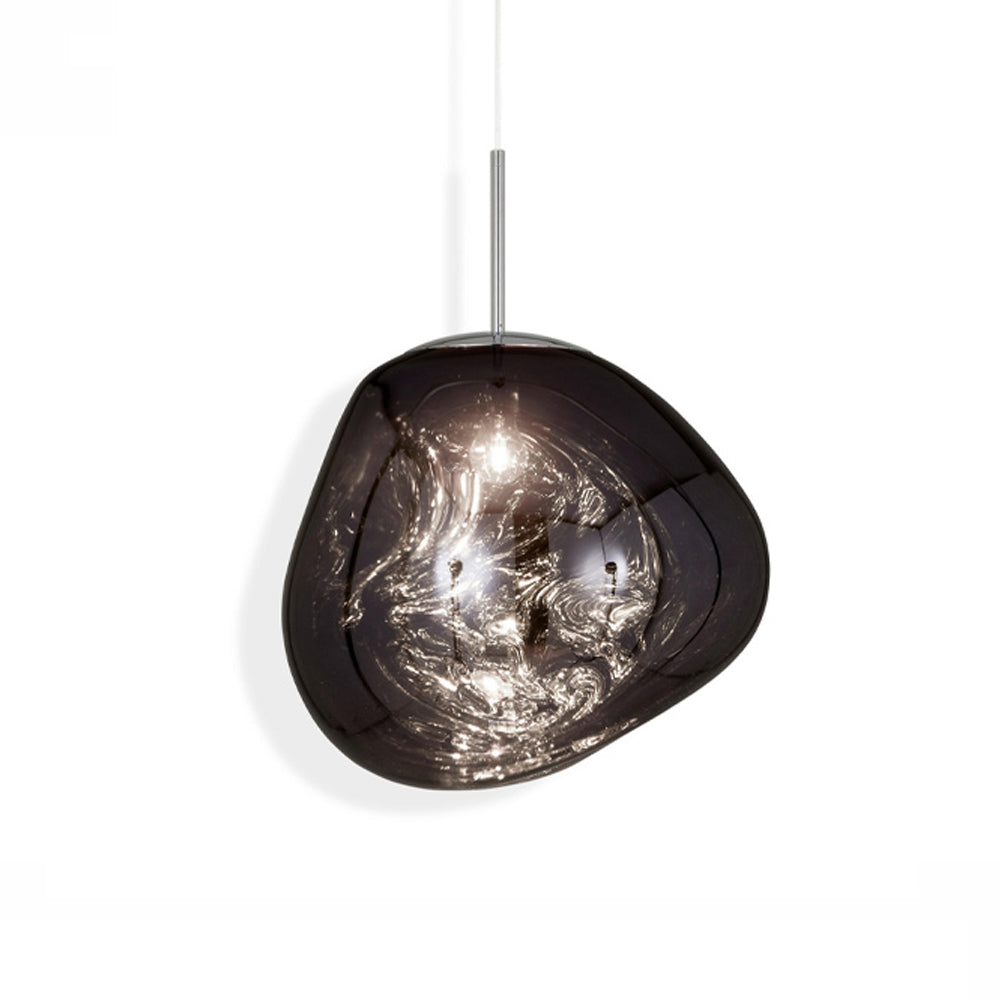 Smokey Gray Melt Lava shade on a white background with a dark reflective uneven surface