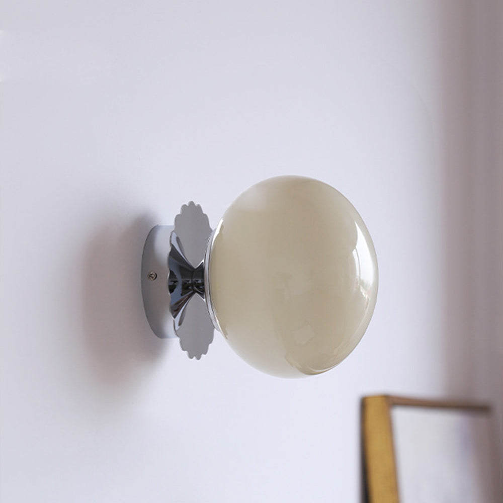 Cream-beige rounded glass shade on chrome short connector, scalloped trim and round plate