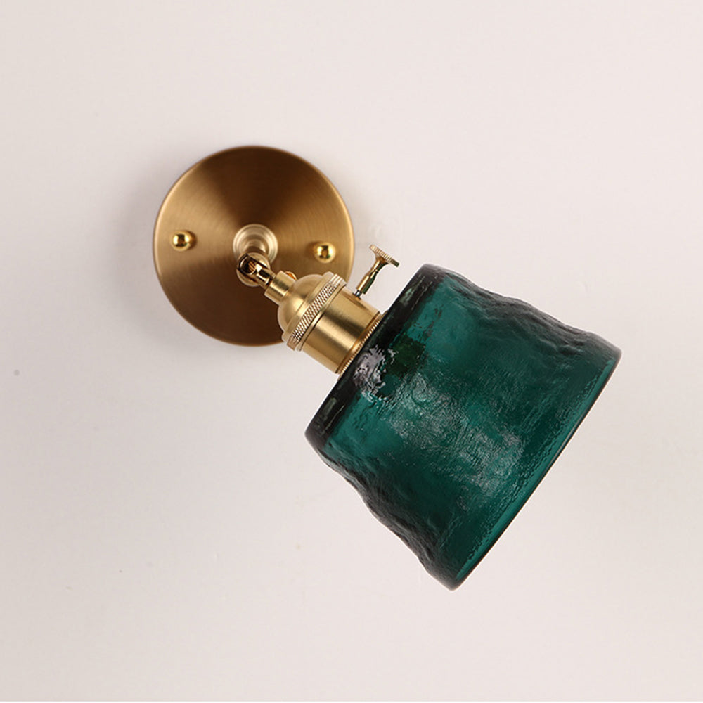 Unlit tilted green textured shade with side knob and gold-tone round wallplate