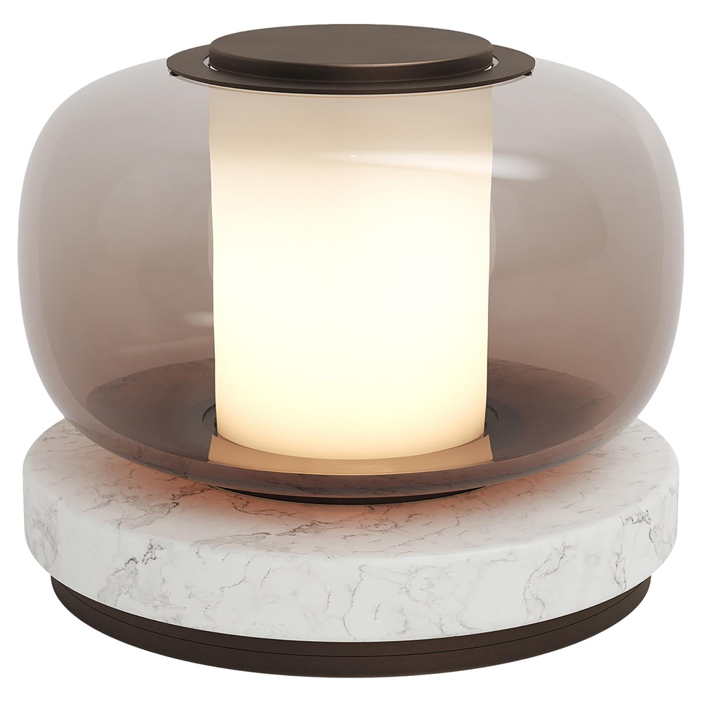 Close view of the glowing cylindrical centre inside light-brown glass, with a brown disc cap and pale round veined base
