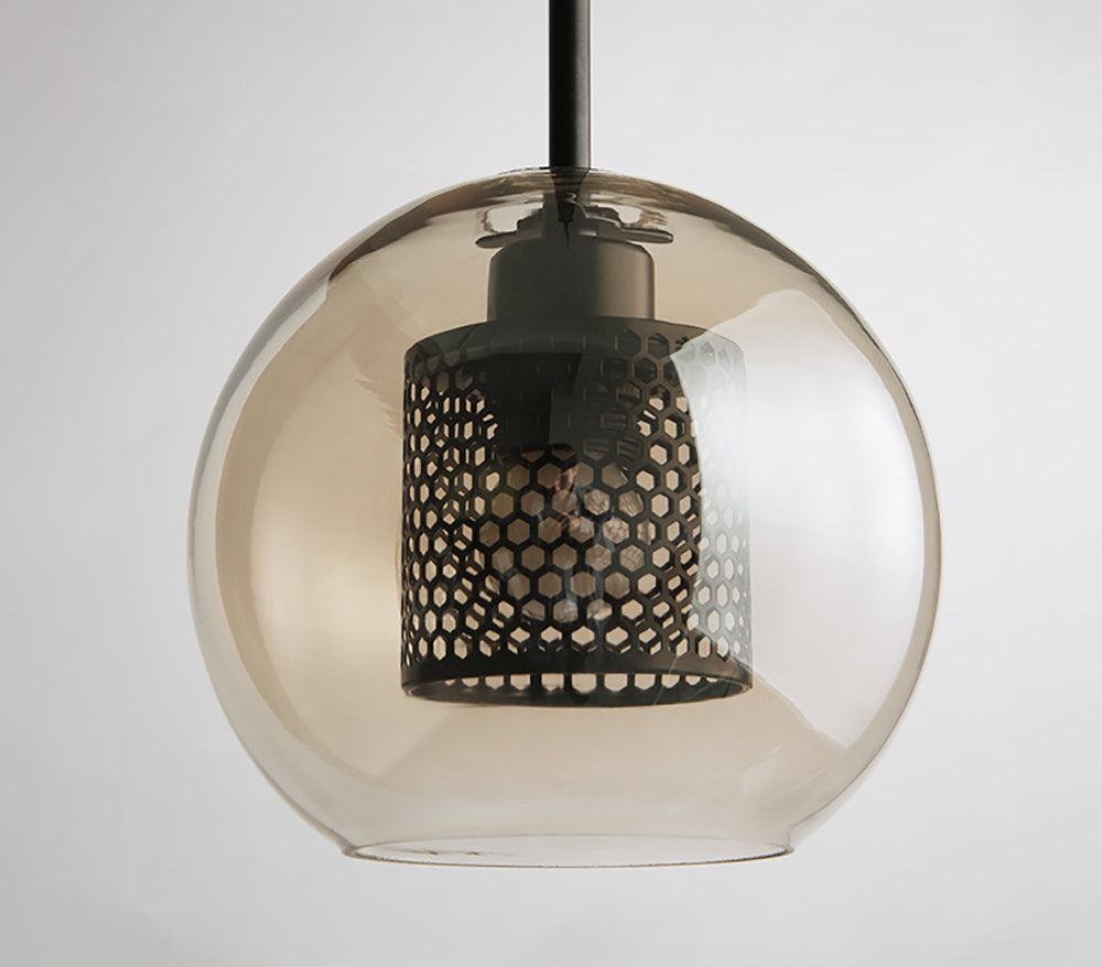 Amber-tinted shade with dark perforated inner cylinder
