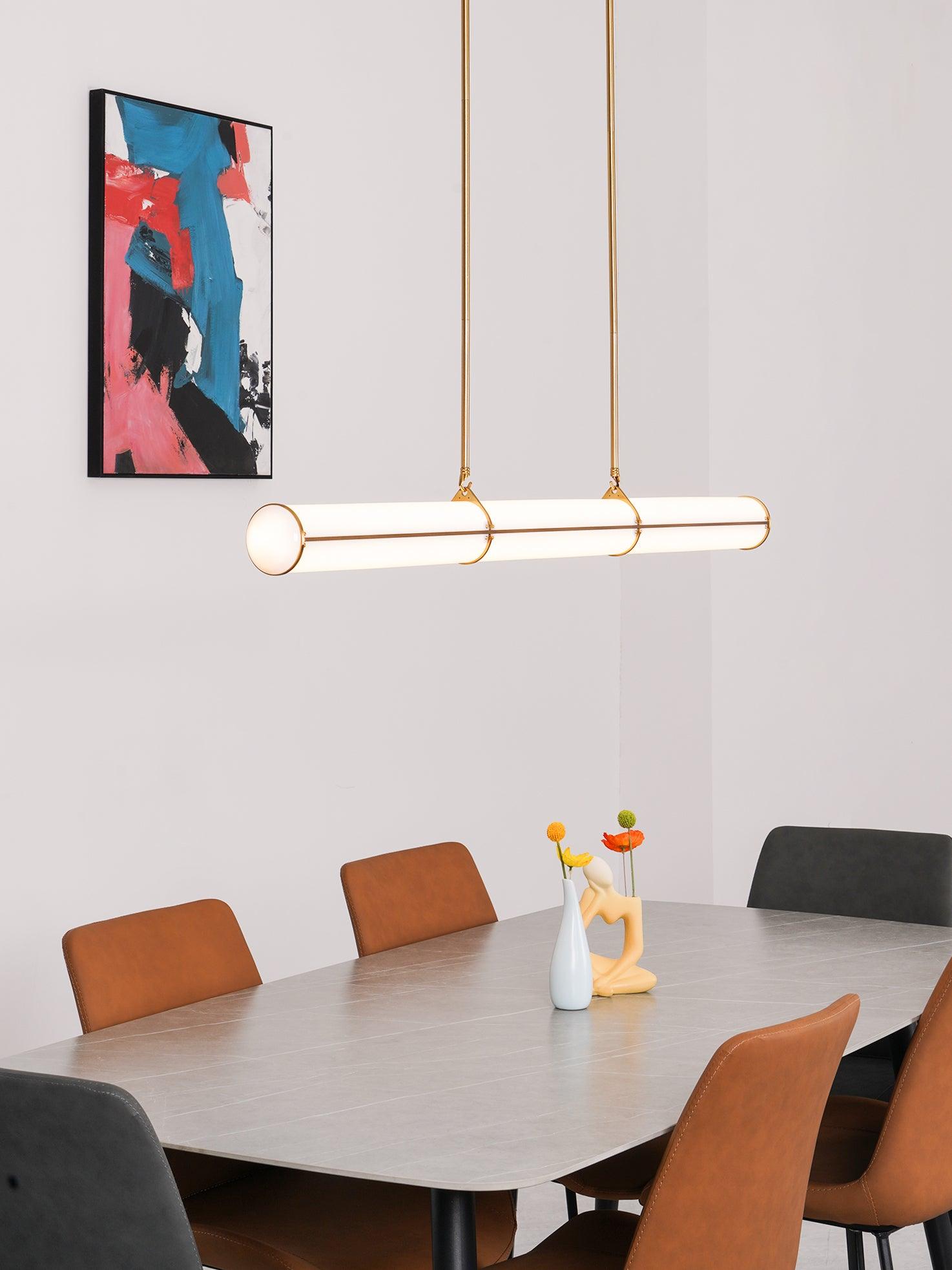 Gold linear pendant in a dining room