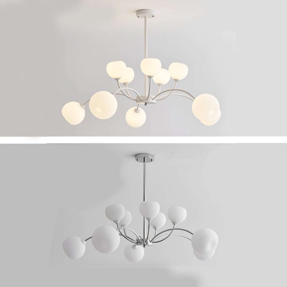 Two-panel view of an illuminated white-frame globe chandelier and an unlit chrome-frame version