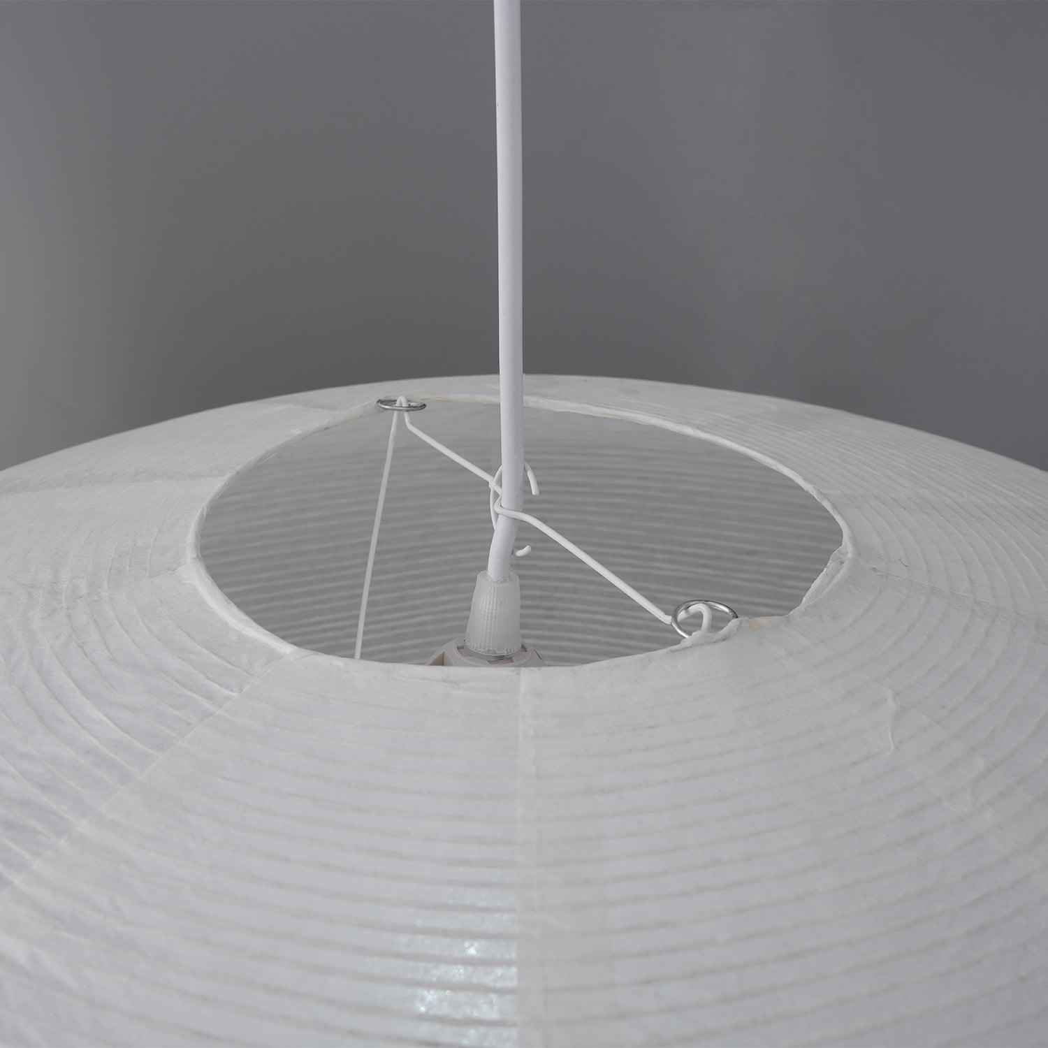 Close-up of the paper shade’s top opening with support wires, rings, cable and socket sleeve