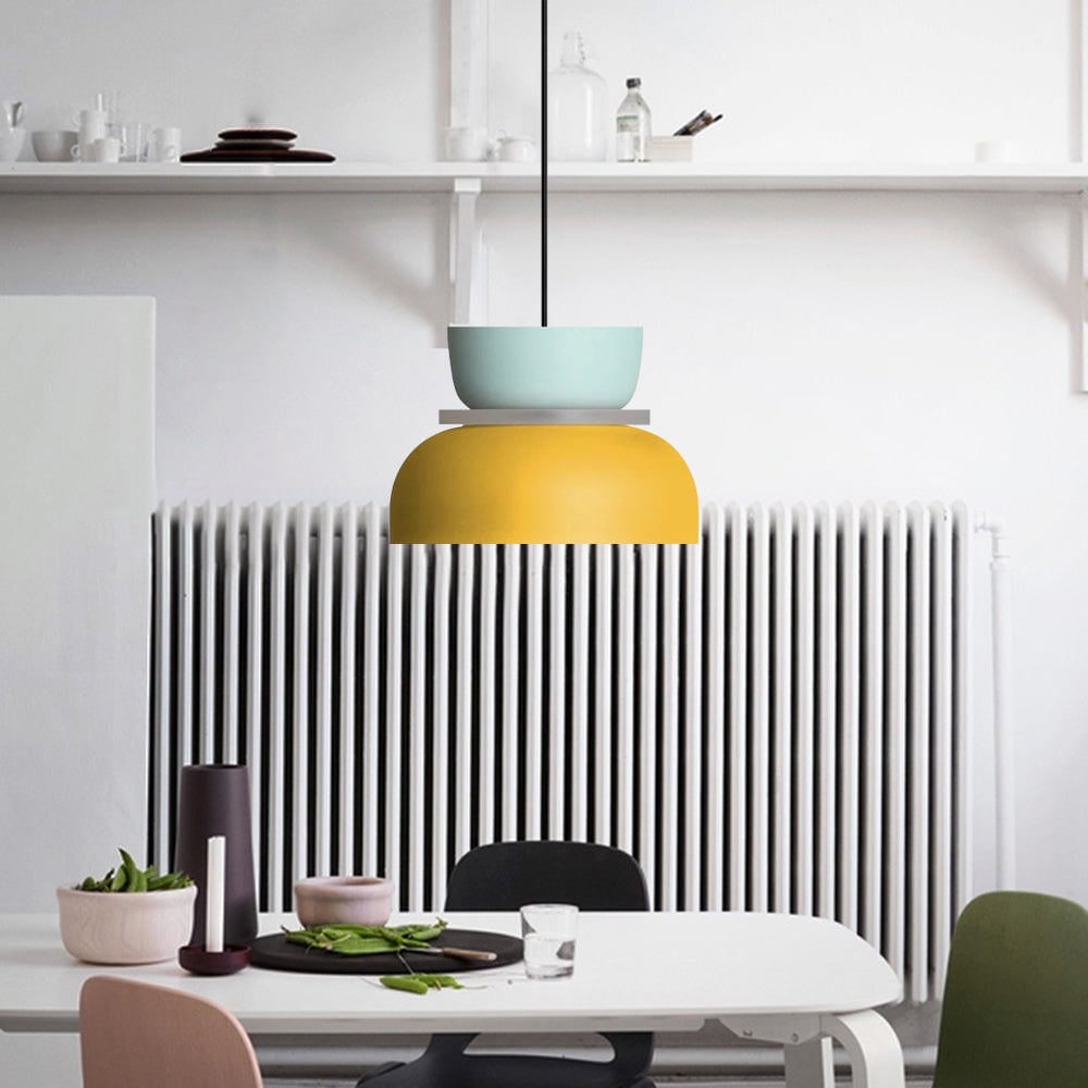 Blue Yellow option with a pale-blue upper bowl and yellow lower shade above a white table by a radiator