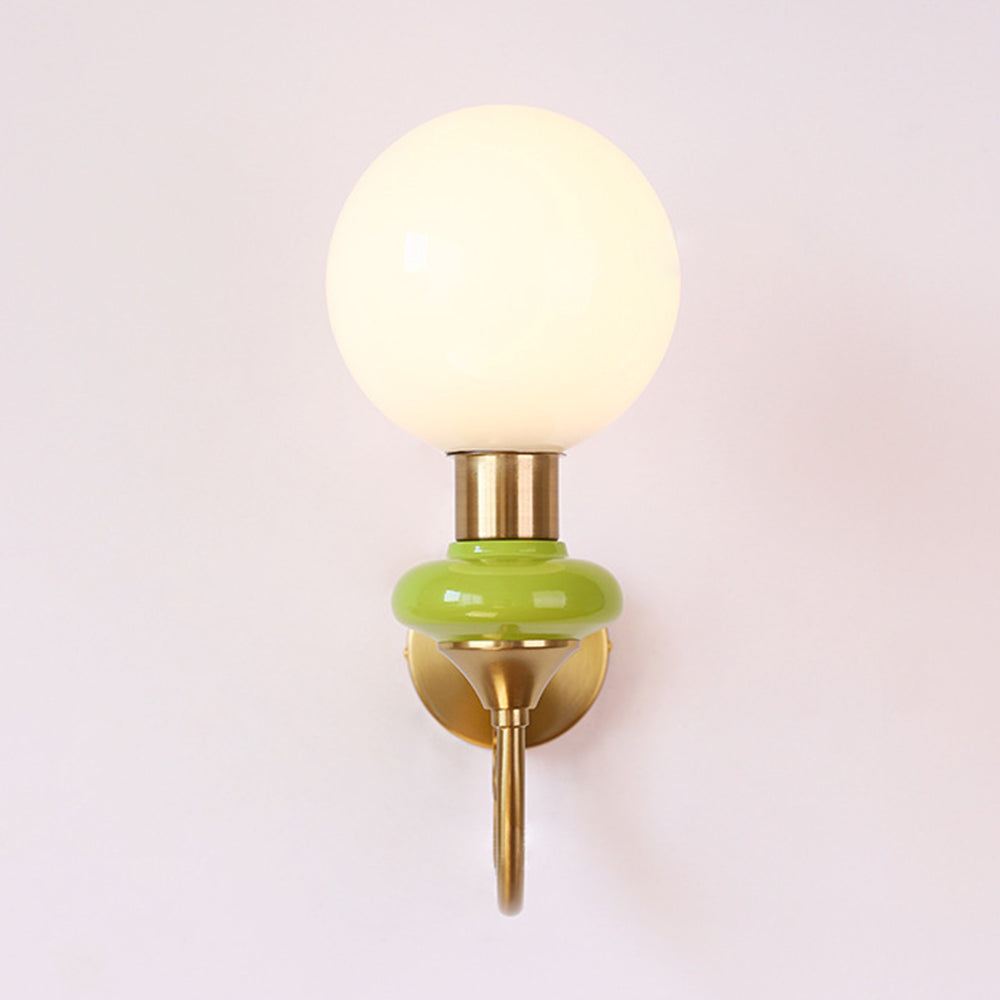 Front view of gold-and-green globe sconce