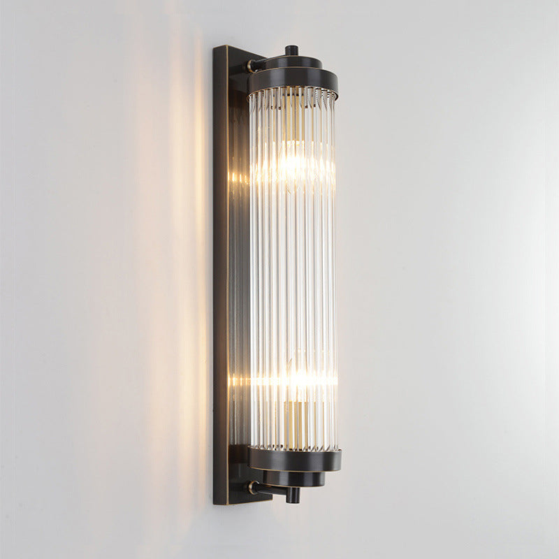 Black Crystal Pillar fitting on a grey wall, showing its straight glass rods, end rings and backplate