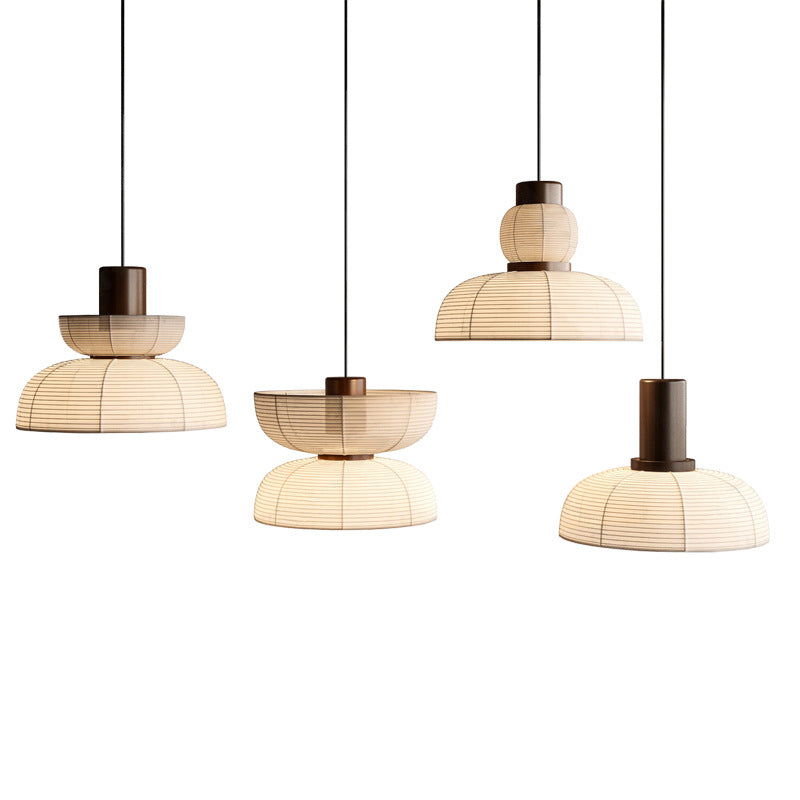 Four isolated ribbed pendant silhouettes arranged side by side with separate black cords