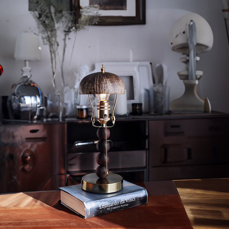 Retro table lamp displayed on books in a dining interior