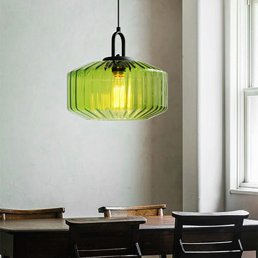 Green pendant over a rectangular table beside a window
