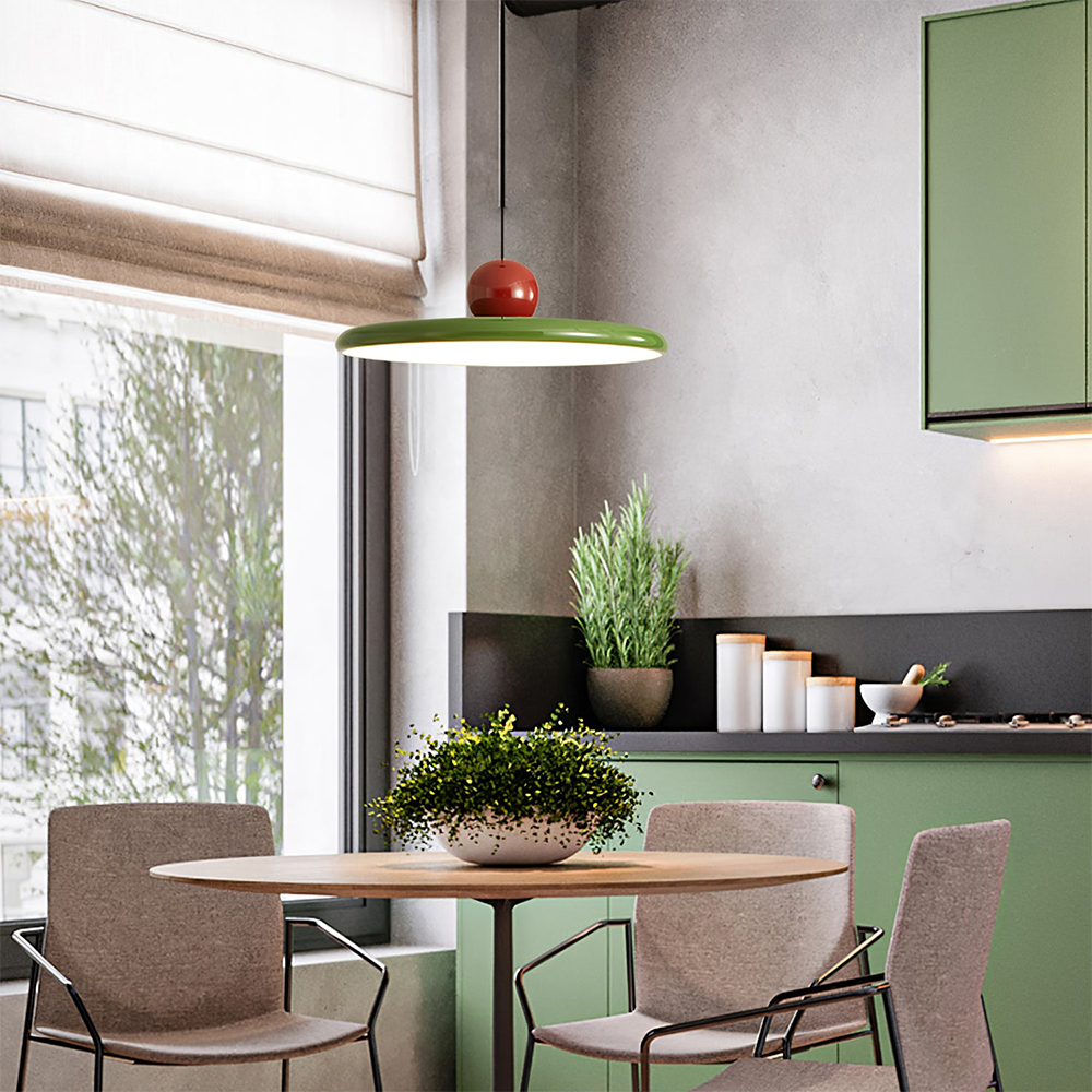 Lola green disc pendant above a table beside a window