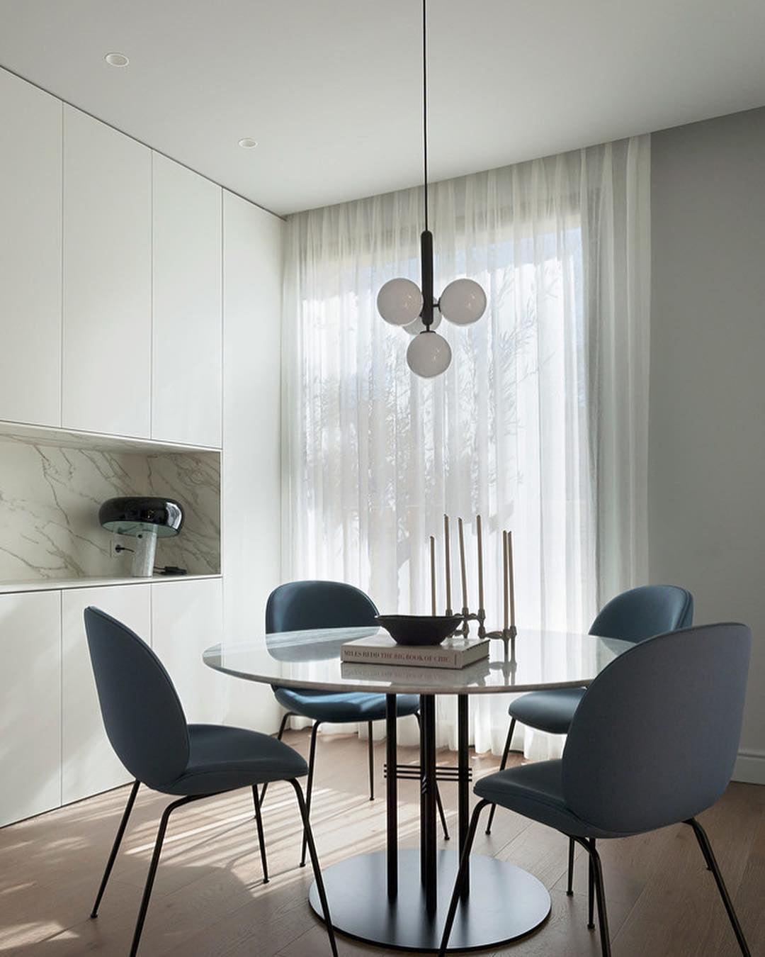 White globe cluster above a small dining table