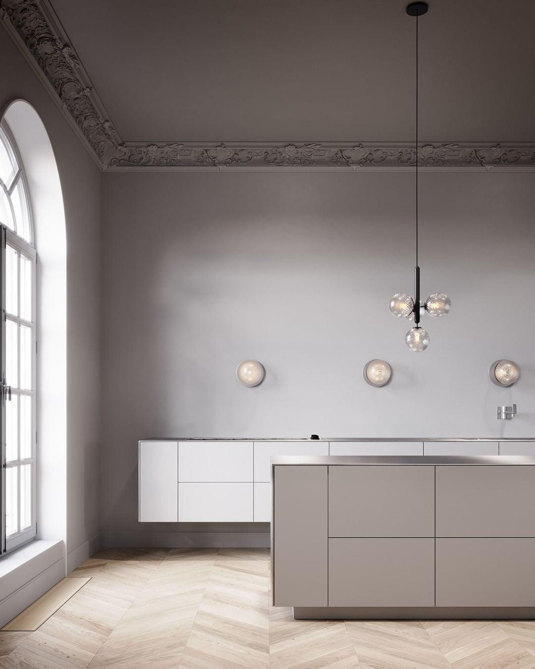 Clear globe clusters near an arched kitchen window