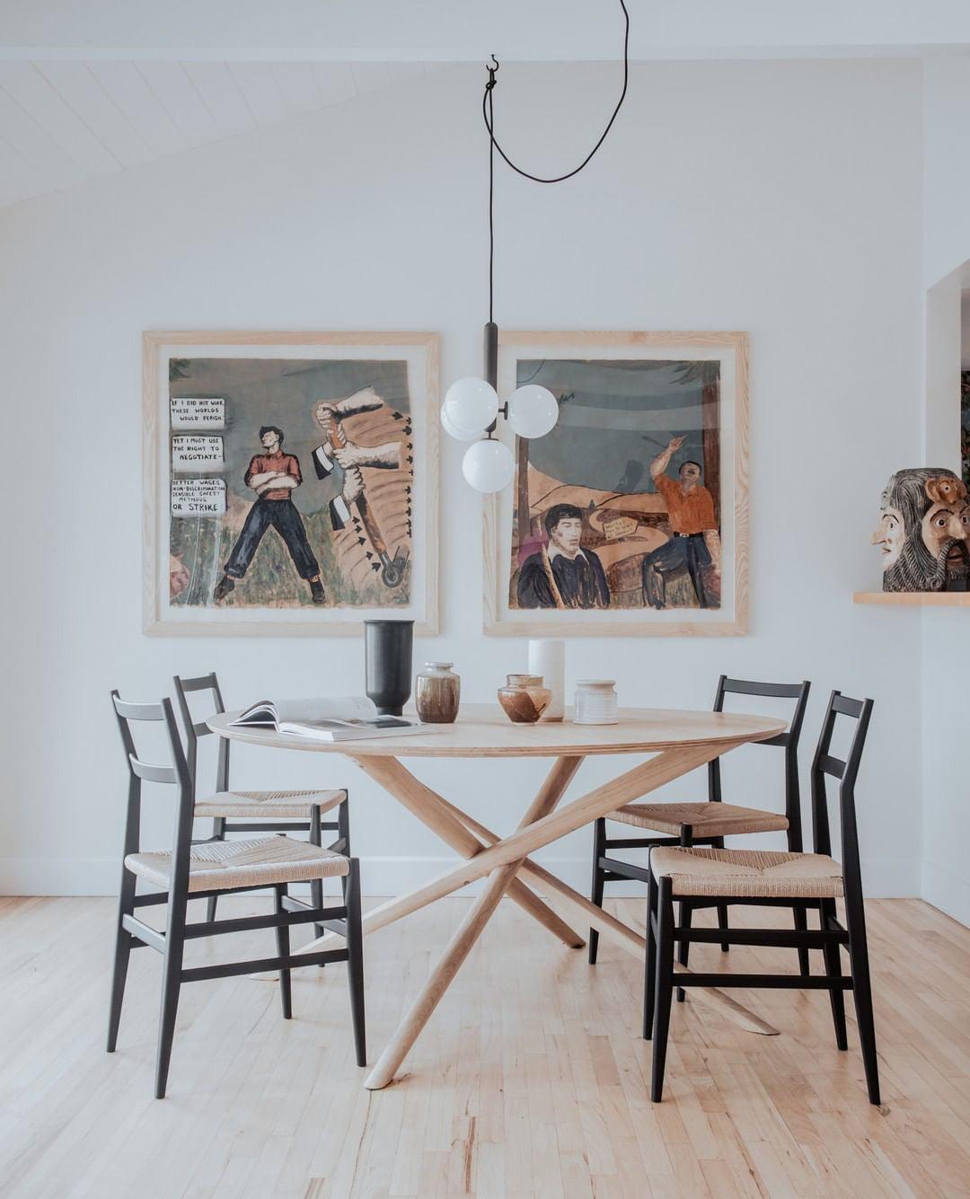 White globe lighting in a room with framed artwork