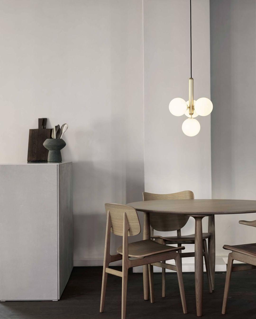 White globe cluster above a small round table