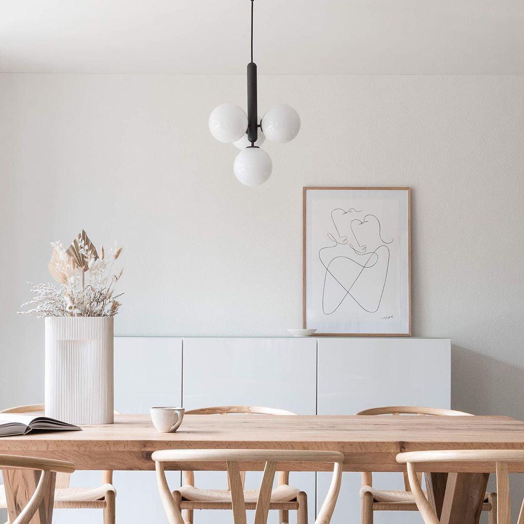 Black-supported white globe cluster over a table