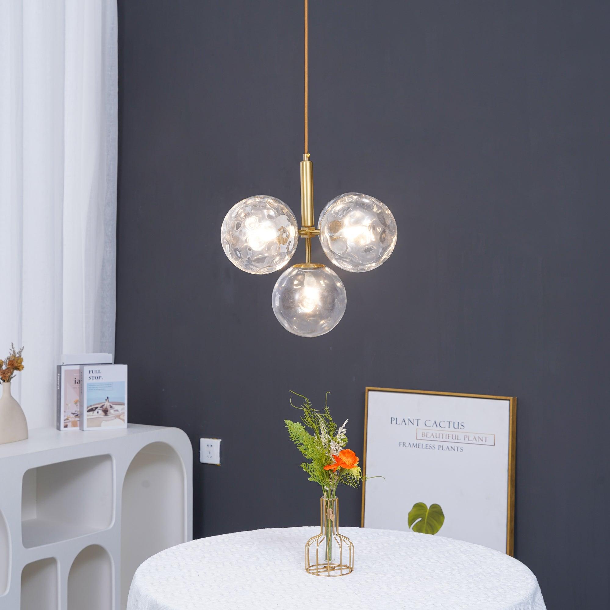 Illuminated clear globe cluster above a small table