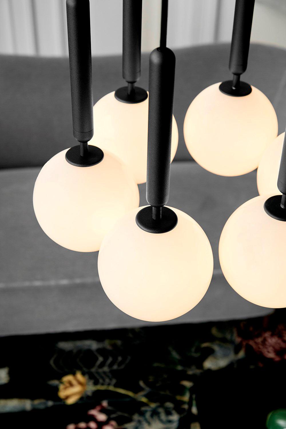Close view of white globes and dark stems