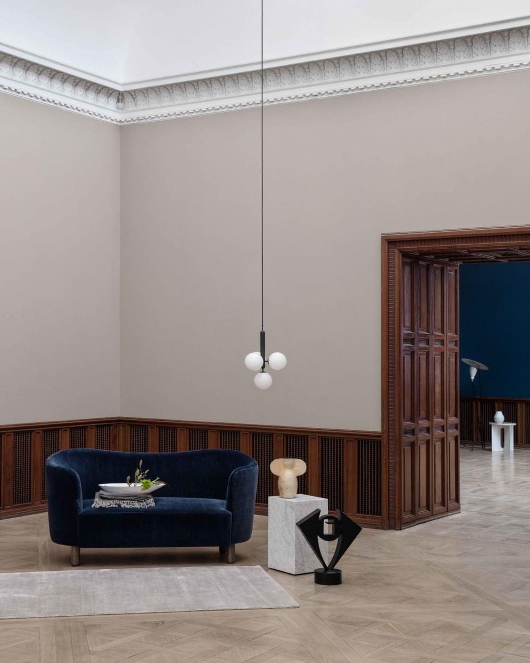 White globe cluster in a high-ceiling living room