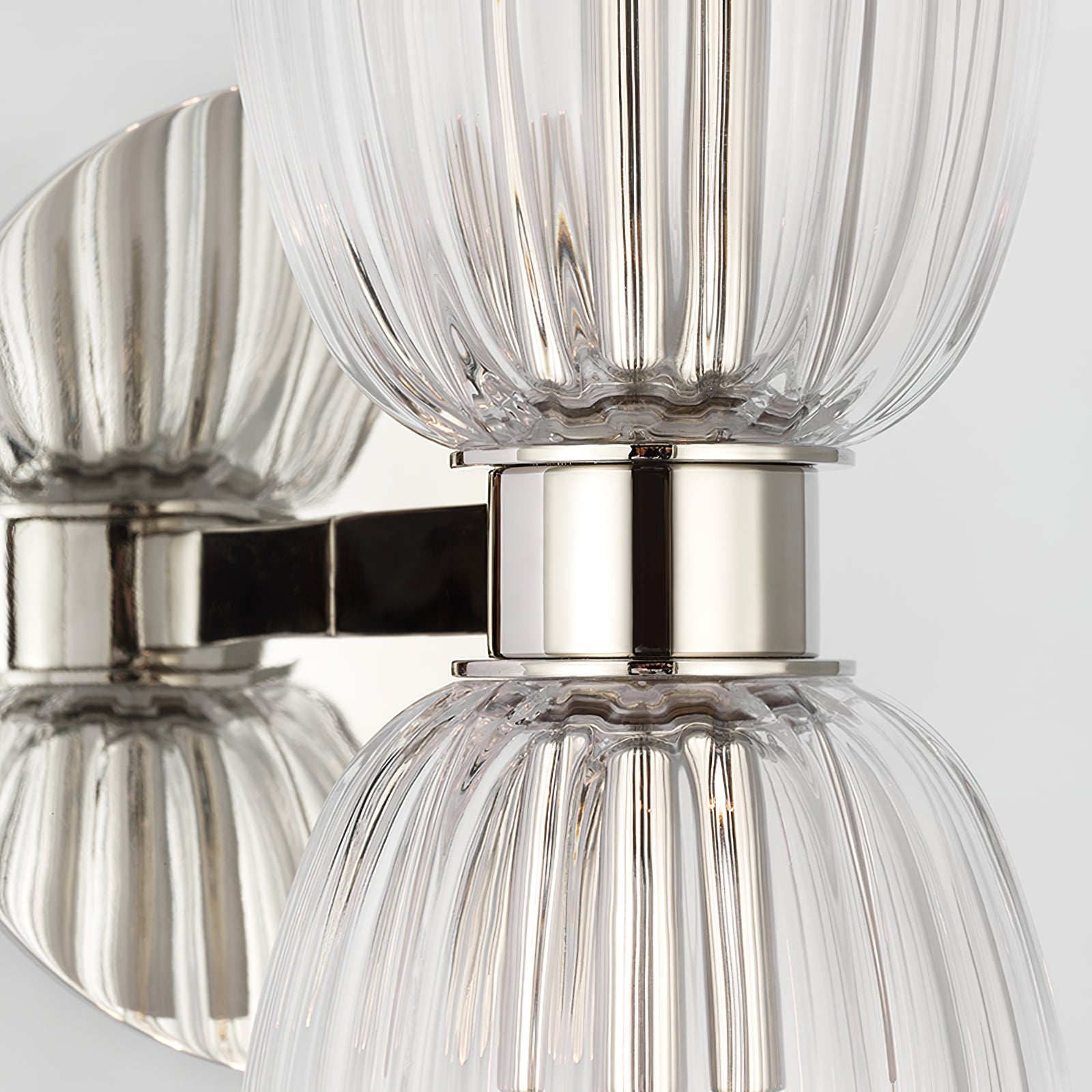 Polished Nickel-tone collar, short arm and round wall plate between upper and lower ribbed glass cups