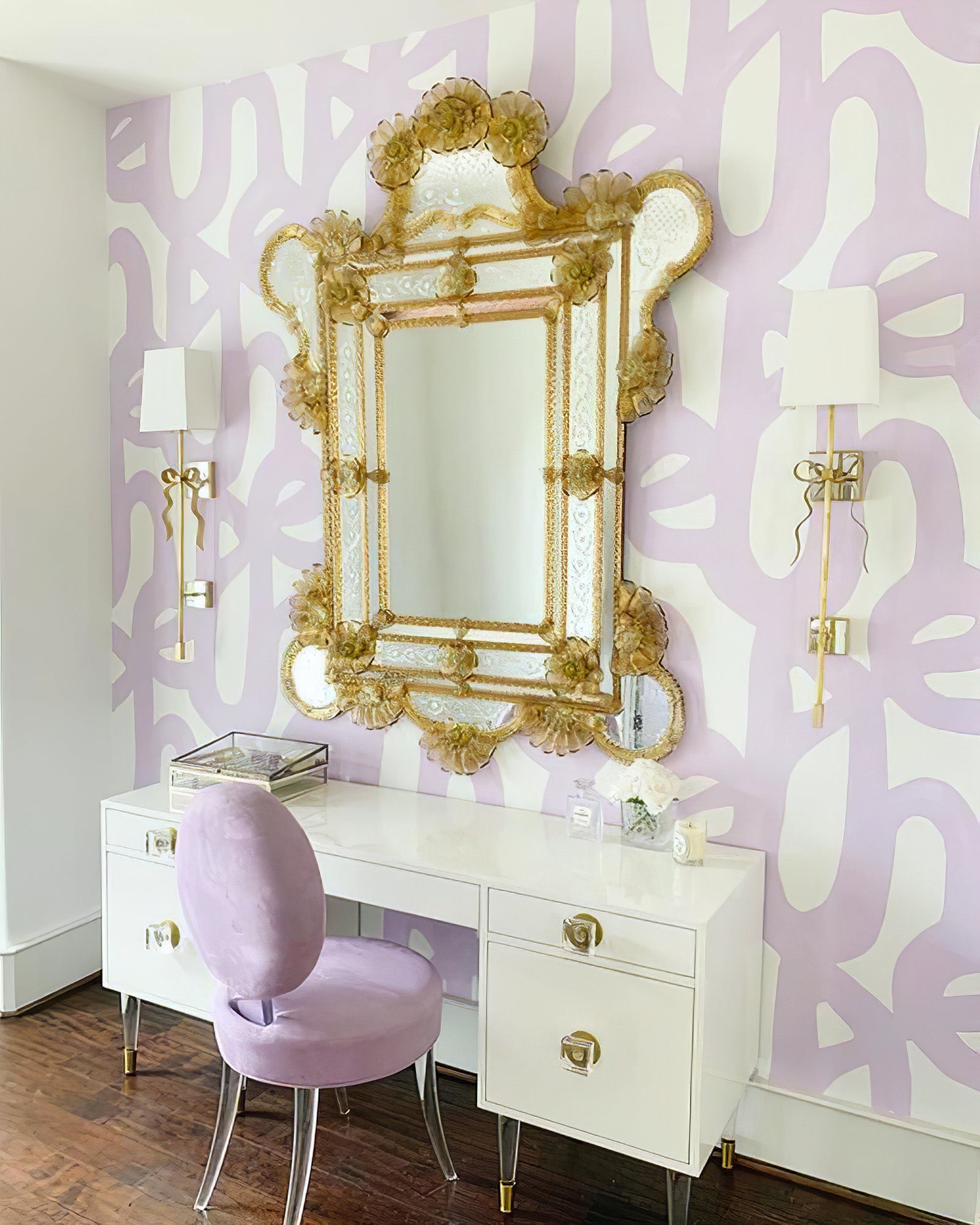Matching Ellery sconces on either side of a mirror above a vanity