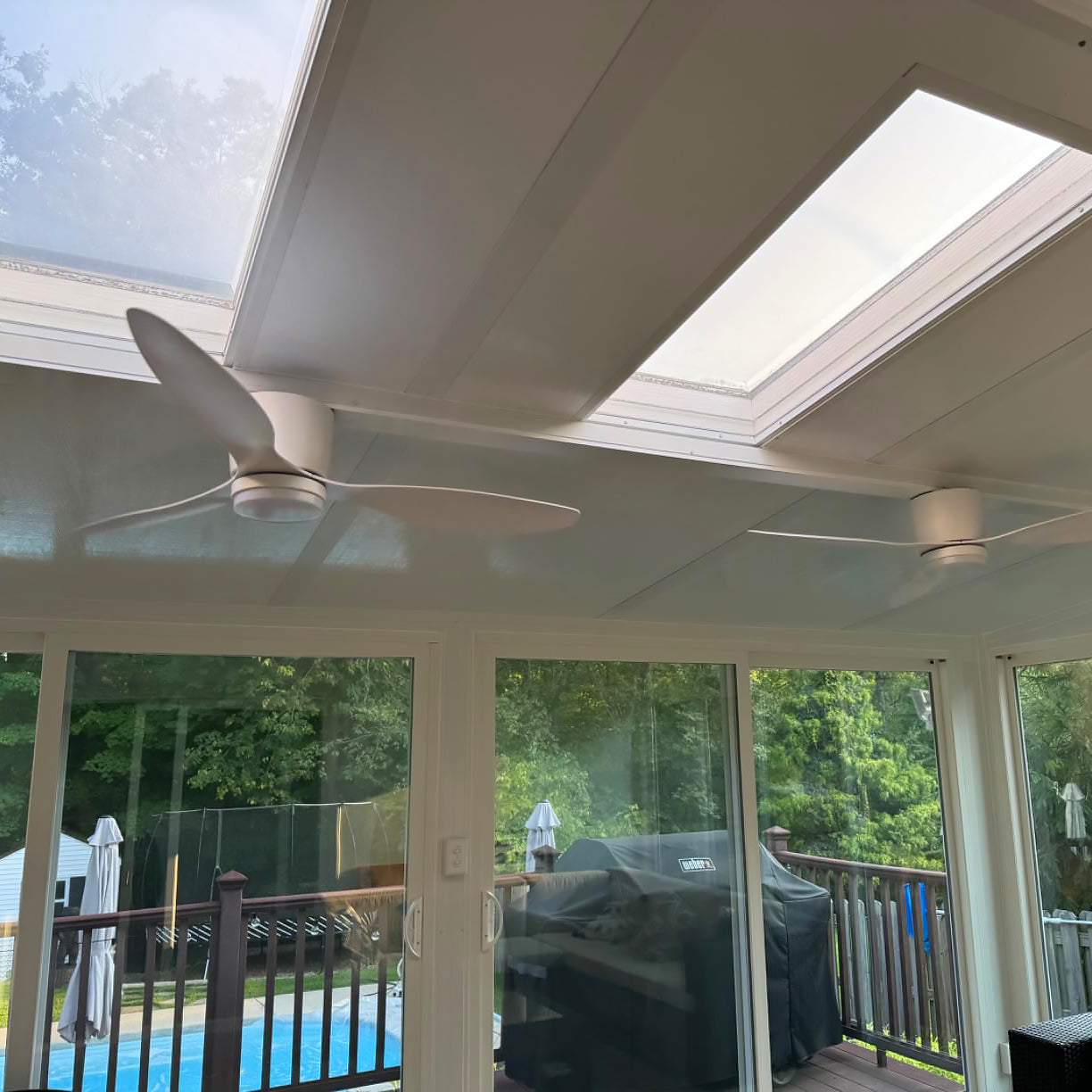 White ceiling fan photographed on a covered porch