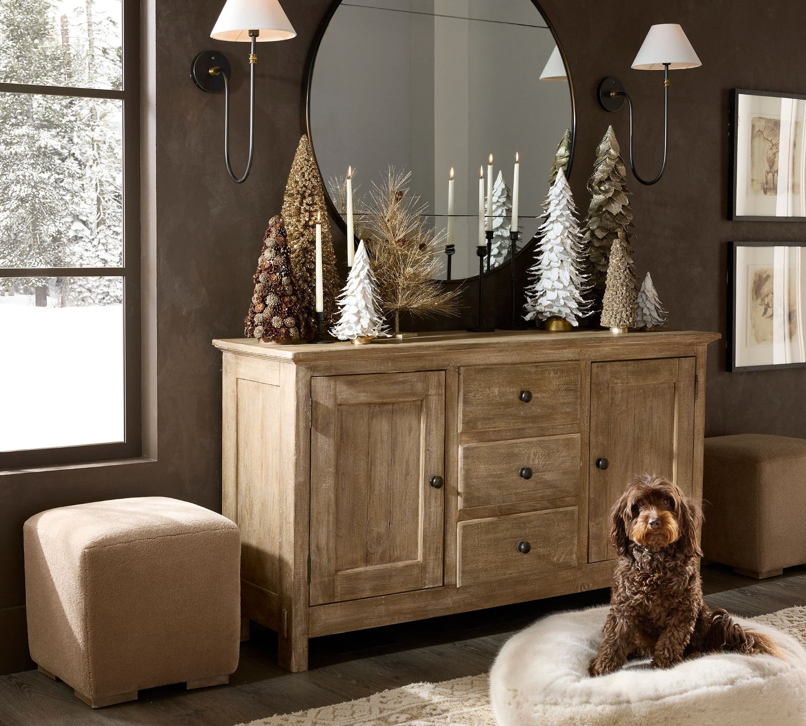 Two Collins wall lamps above a cabinet beside a round mirror