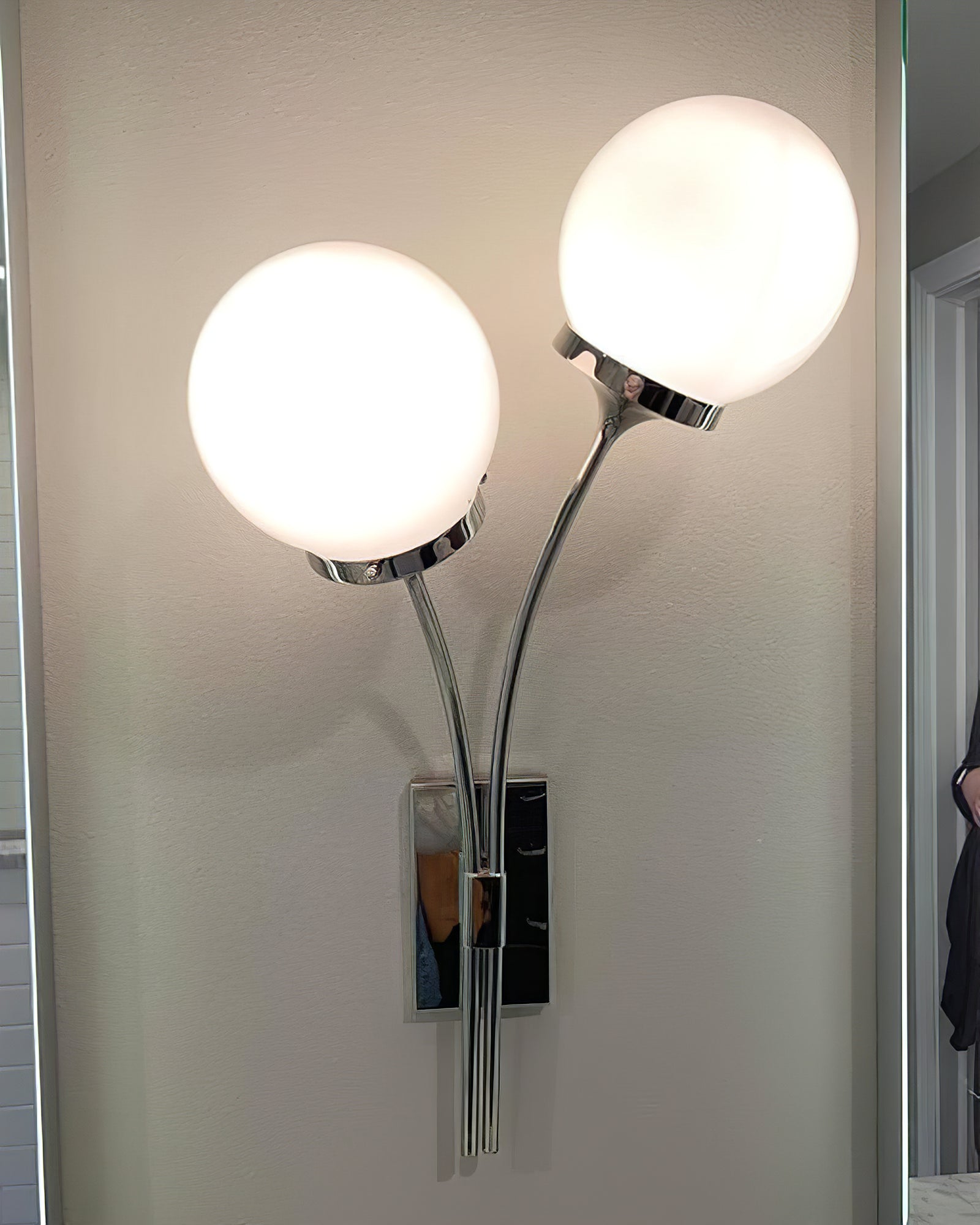 Illuminated nickel sconce with two white globes