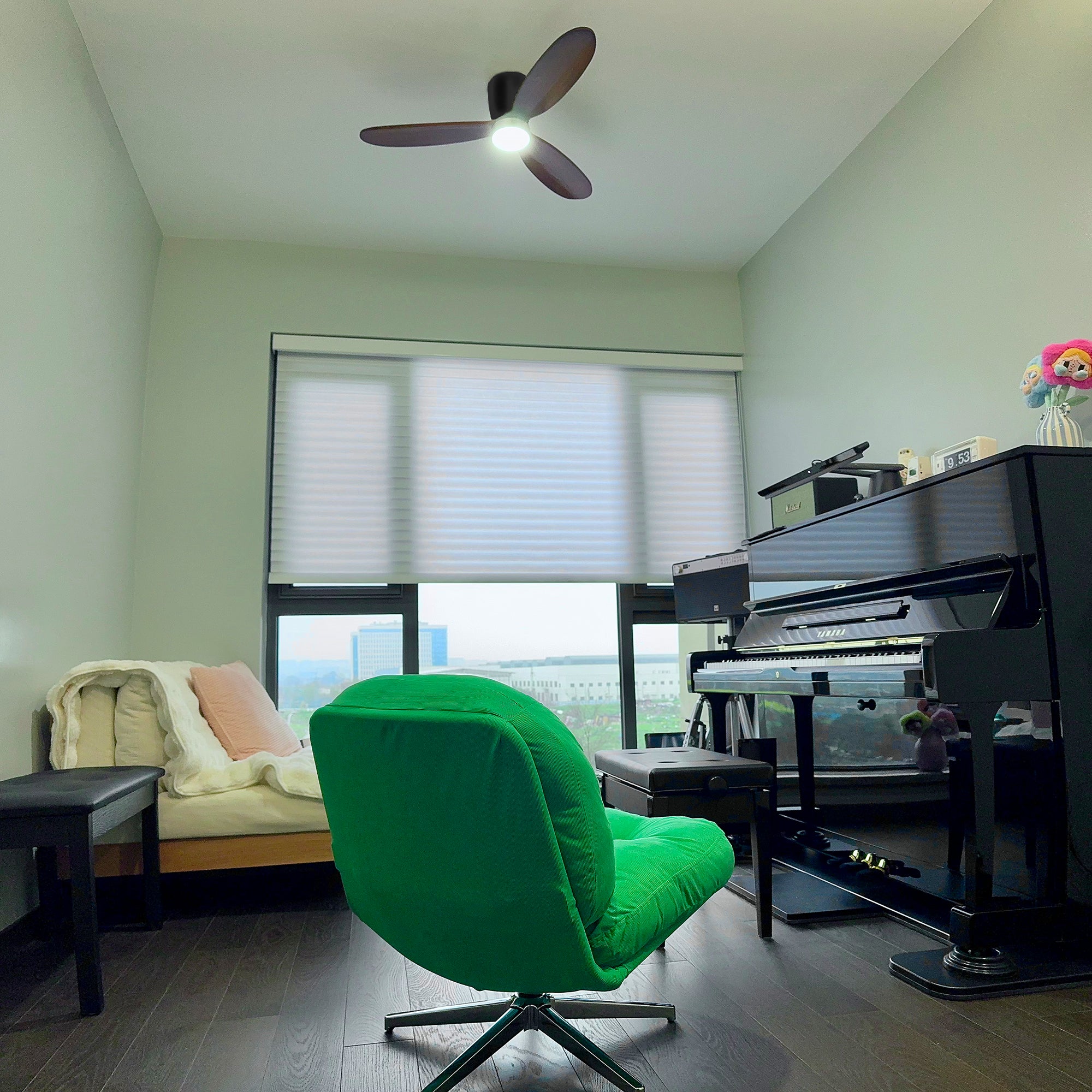 Ceiling fan above a music room with a piano