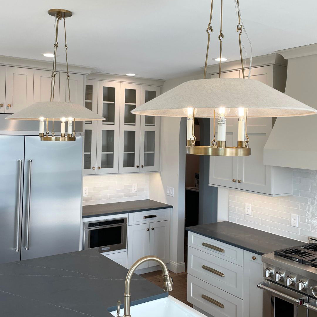 Two Troy Archive chandeliers above a kitchen island