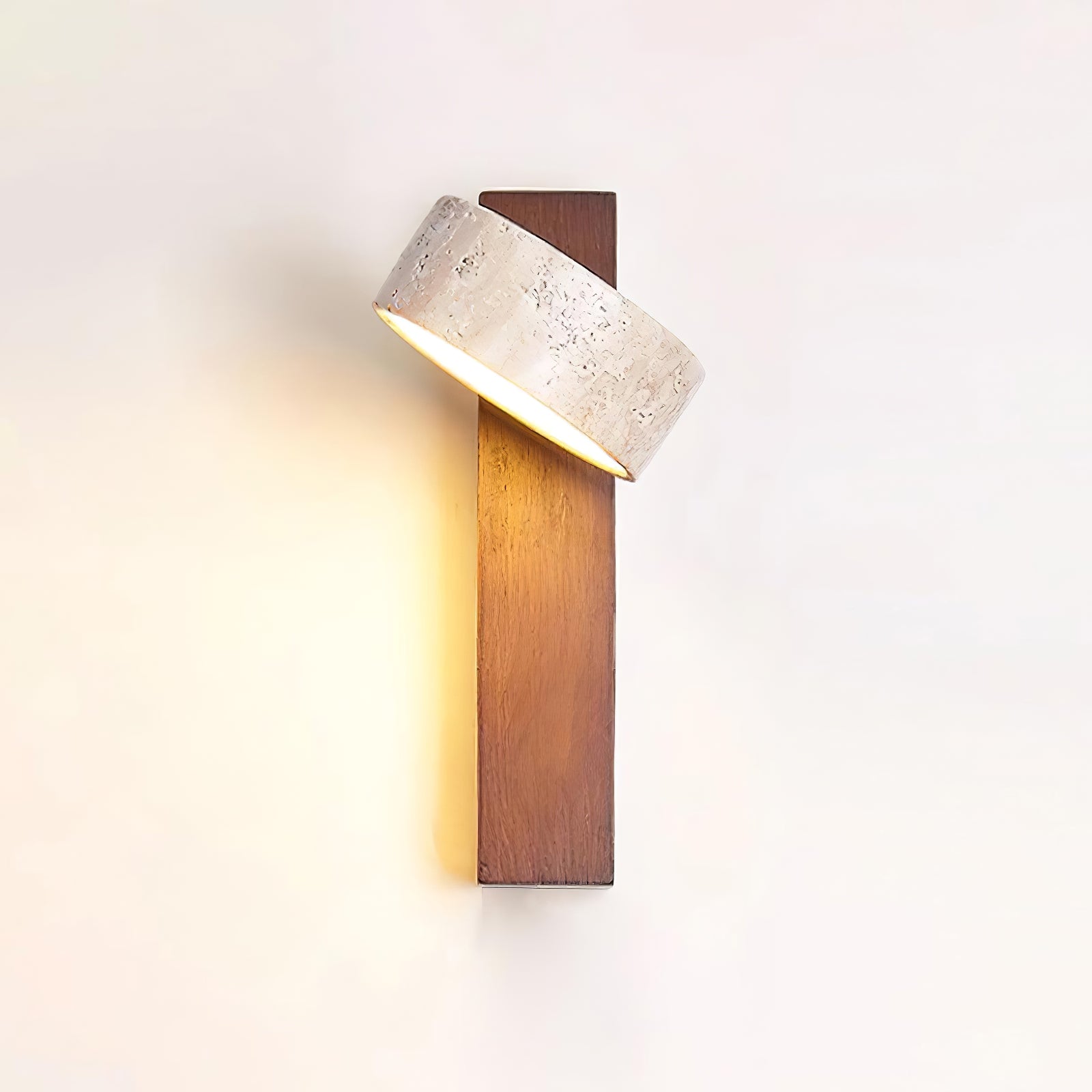 Walnut-colour travertine wall lamp with shade in an angled position