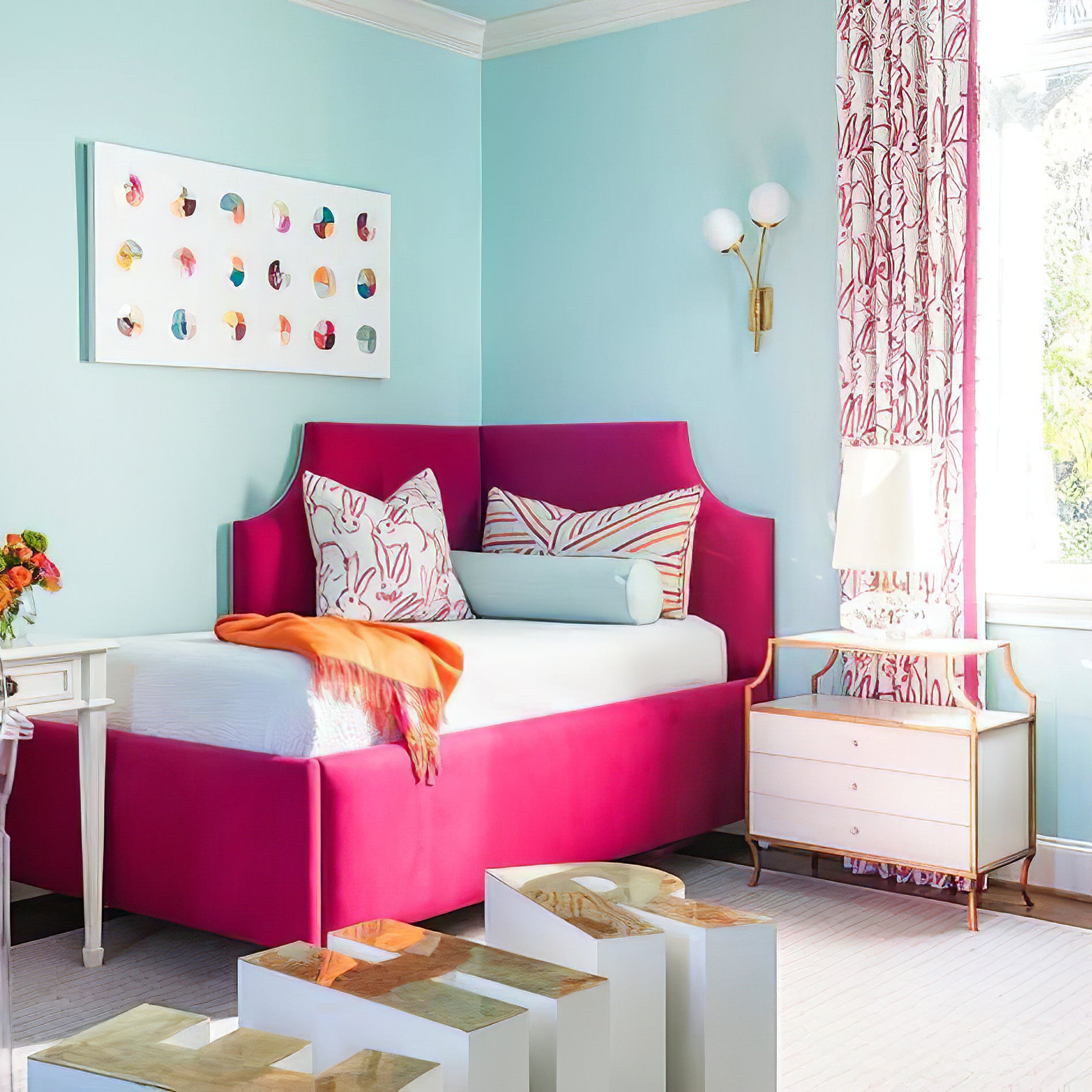 White-globe sconce above a sofa in a colourful room