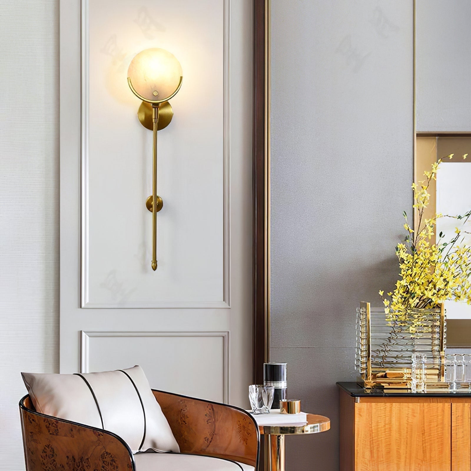 Universal Ava wall light near an armchair and side table